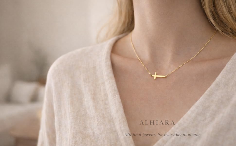 Home Minimalist gold cross necklace close-up